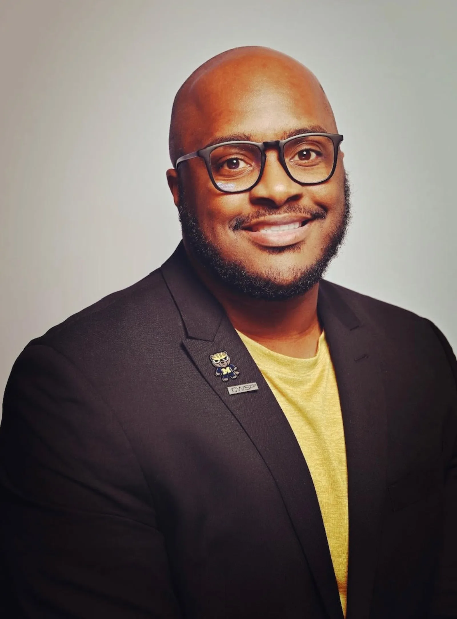 Dr. Alton Johnson, DPM, headshot in a black blazer