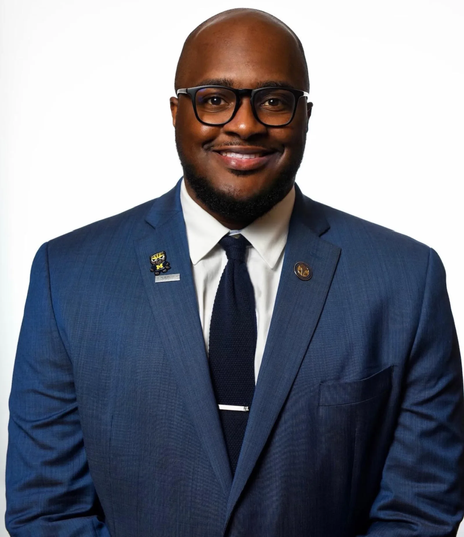 Dr. Alton Johnson wearing a University of Michigan lapel pin