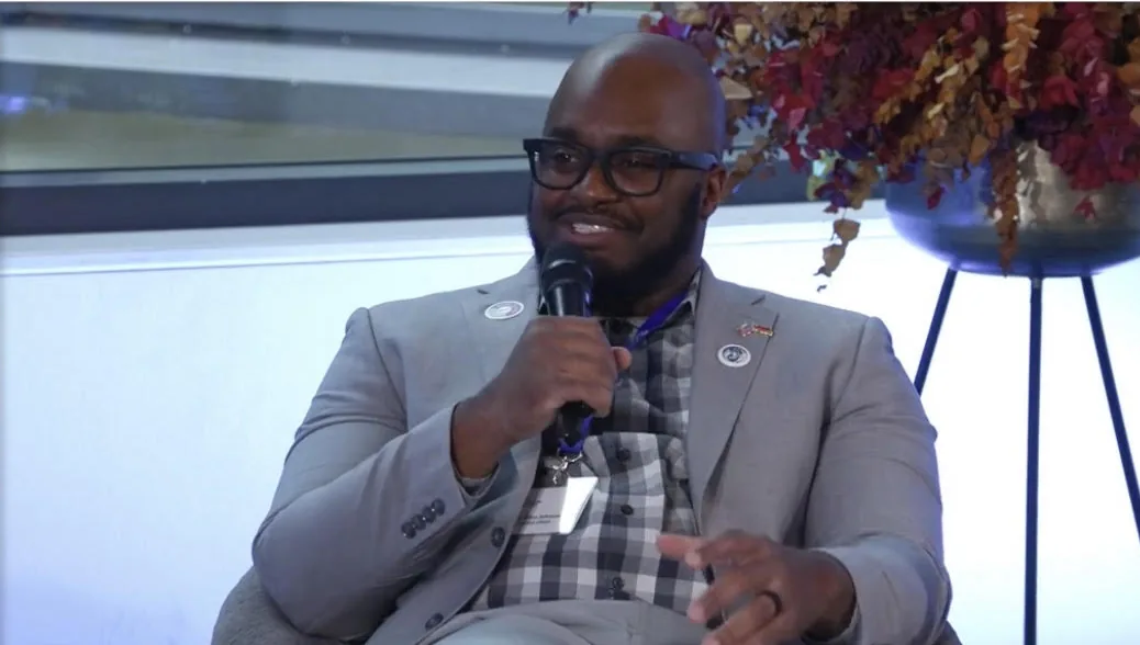 Dr. Alton Johnson speaking into a microphone on the LINK Wound Care Insights panel